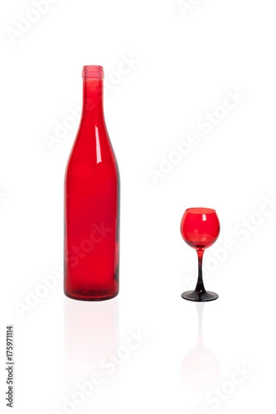 Fototapeta A bottle of red glass with a red wineglass on a white background.