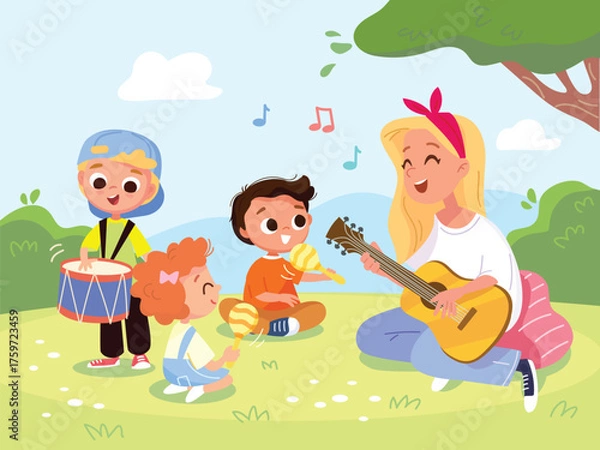 Fototapeta Music teacher leads music class for toddlers on park meadow. Mother plays guitar and sings song for her children sitting on the grass. Children and caregivers spend quality time together in nature.