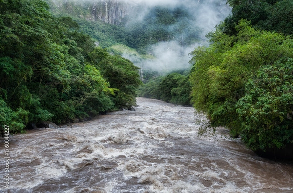 Fototapeta Scenic dramatic view with the powerful waters of Urubamba River crossing the Sacred Valley in Aguas Calientes