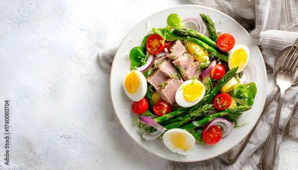 Fototapeta Salad with tuna, tomatoes, asparagus and onion. Salad Nicoise. Flat lay. Top view