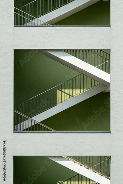 Fototapeta Geometric Stairwell Viewed Through Rectangular Wall Openings