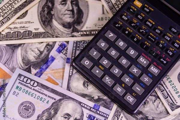 Fototapeta Modern calculator on a one hundred dollar bills