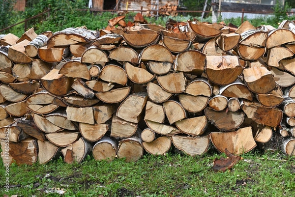 Fototapeta Rural landscape with a woodpile