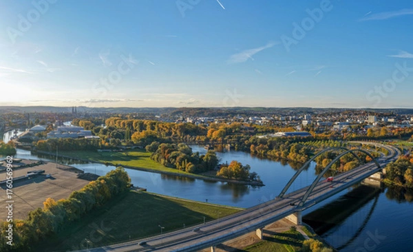 Fototapeta Modern Bridge and Riverside Cityscape in Autumn Colors