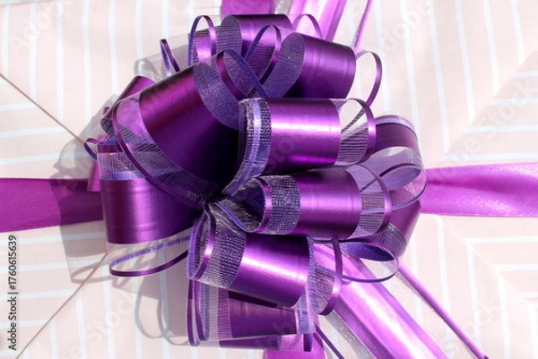Fototapeta  Background made of a large lilac packaging bow.