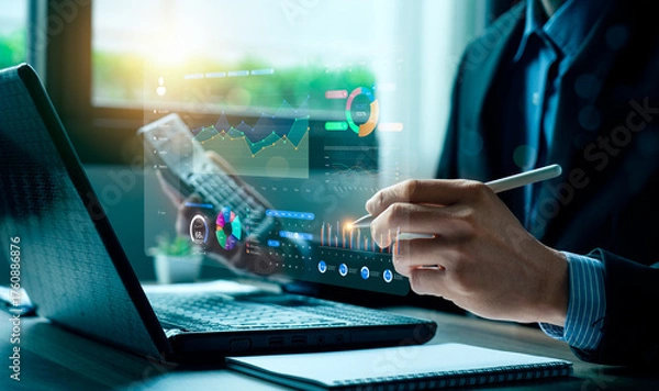 Fototapeta Business professional analyzing digital data dashboard with futuristic charts on laptop, representing financial analytics, business intelligence, digital transformation, data-driven decision making.