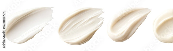 Fototapeta Four swatches of creamy, light beige cosmetic product, each with a smooth, swirled texture