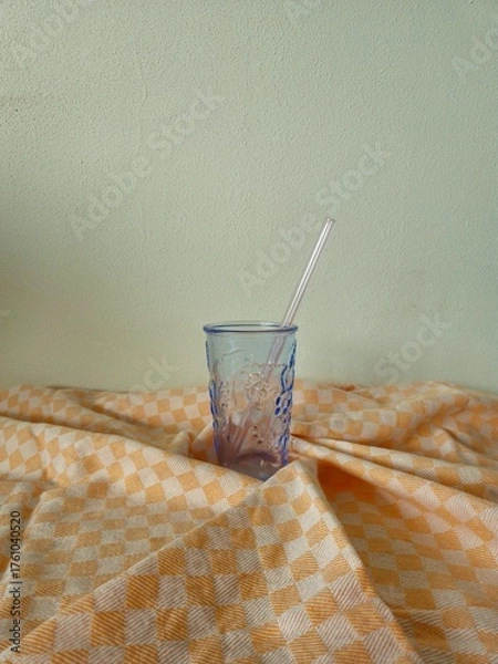 Obraz glass with multi-colored straws. Reusable glass Straws in Glass on white background. empty glass with colorful straws on a white background.