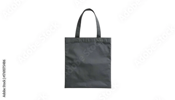 Fototapeta A simple gray tote bag stands upright against a black backdrop, showing handles