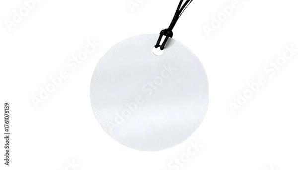 Fototapeta Plain, circular white tag, hanging by a black string, set against a stark black background