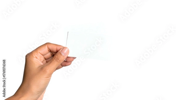 Fototapeta Hand holding two blank cards against black backdrop, with visible skin and card edges