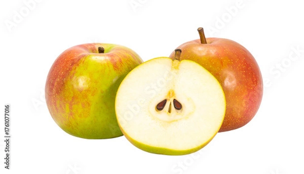 Fototapeta Three apples, one cut in half, showing seeds and texture, set against black