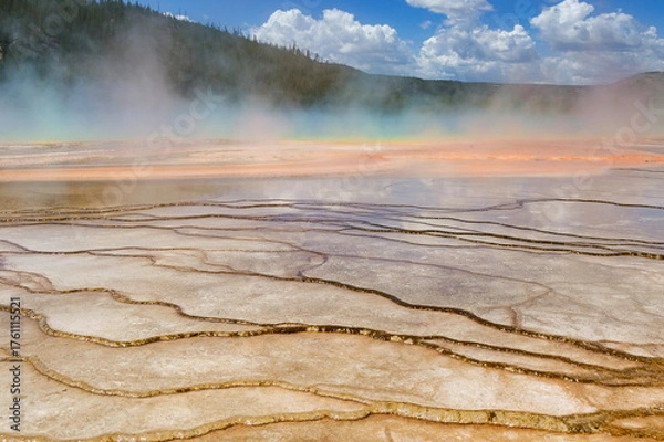 Obraz Yellowstone, Wyoming, USA - 28 May 2025: Scenic view of water running over mineral deposits at the Grand Prismatic Spring in Yellowstone National Park,.