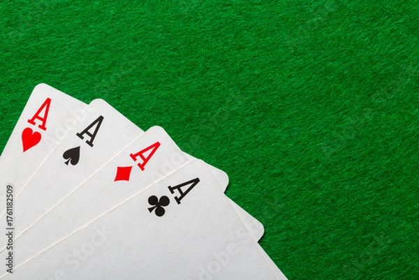 Fototapeta Casino, poker and gambling concept. Four aces on the green casino table. Free space for your text