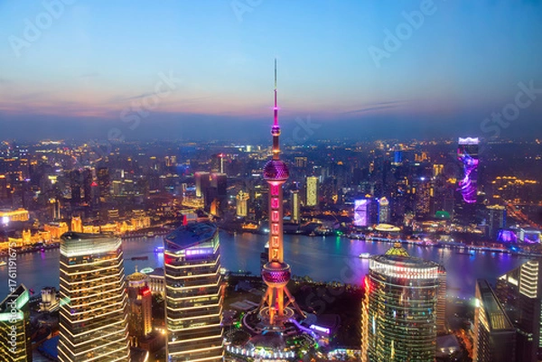 Fototapeta Aerial cityscape of Shanghai, China at sunset. Panoramic view of Pudong business district skyline from the skyscraper.