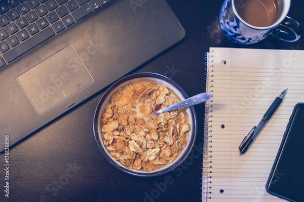 Fototapeta Working Through Breakfast