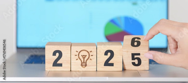 Obraz 2025 end year to Happy New Year 2026 block with lightbulb icon against computer laptop background. Business Idea, Creative, Thinking, brainstorm, Goal, Resolution, strategy, plan, Action and change