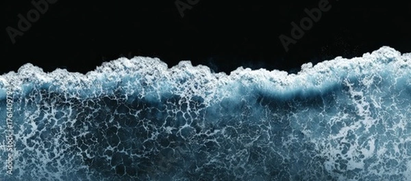 Obraz Ocean waves crashing on a black background