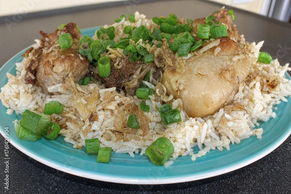 Fototapeta Appetizing dish of steamed rice topped with tender meat and fresh sprouts — elegant Asian cuisine.