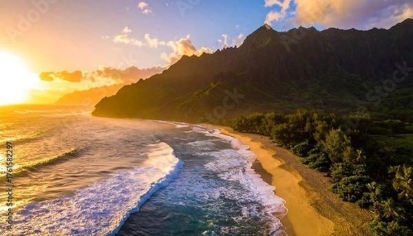 Fototapeta Aerial view of a sunlit beach with waves crashing on the shore, mountains in the backdrop, and vibrant sunset hues