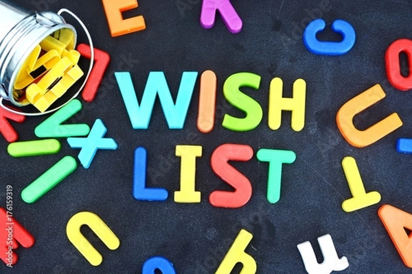 Obraz Wish list concept with colorful letters on blackboard pouring out from a metallic bucket