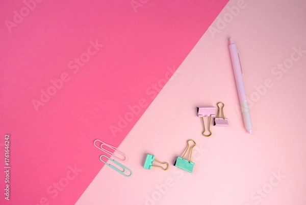 Fototapeta blank paper next to school tools with no word as a template for text space concept. business and education concept. pink background
