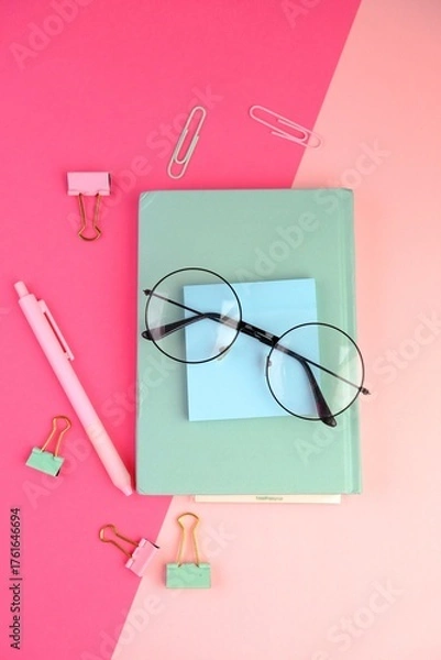 Fototapeta blank paper next to school tools with no word as a template for text space concept. business and education concept. pink background