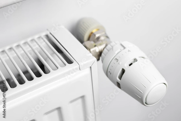Fototapeta Radiator with thermostat valve in the home
