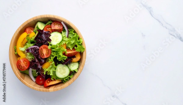 Fototapeta サラダボウルがおかれた白いキッチンテーブル