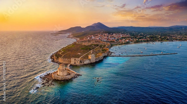 Fototapeta Aerial view of the old venetian Castle and Bourtzi tower at the town of Methoni, Messenia, Peloponnese, Greece, during summer sunset time