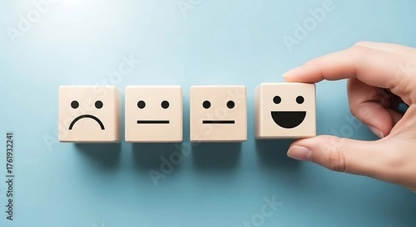 Fototapeta Customer satisfaction survey with wooden blocks showing different emotions from sad to happy