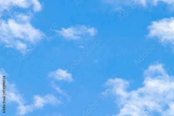 Obraz Clear Blue Sky with Soft White Clouds Background