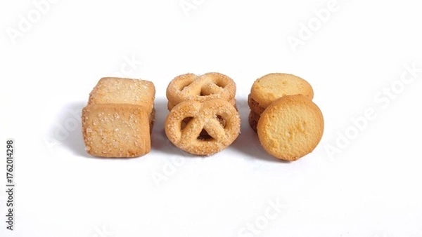 Fototapeta Three Varians of Danish butter cookies isolated on white background with copy space. Perfect for design element, baked pastry, sweet food concept or any commercial usages. High angle view.