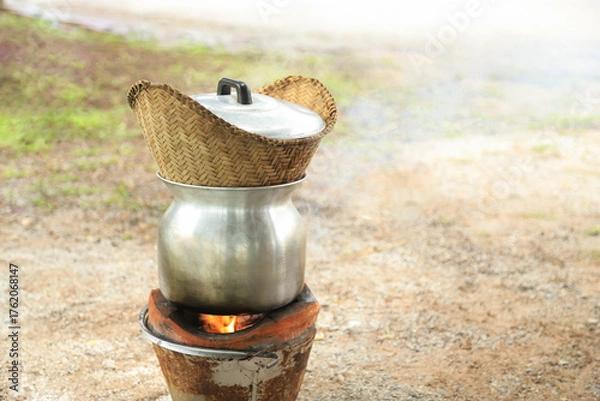 Obraz streamed cooked stove for making sticky rice on hot stove in