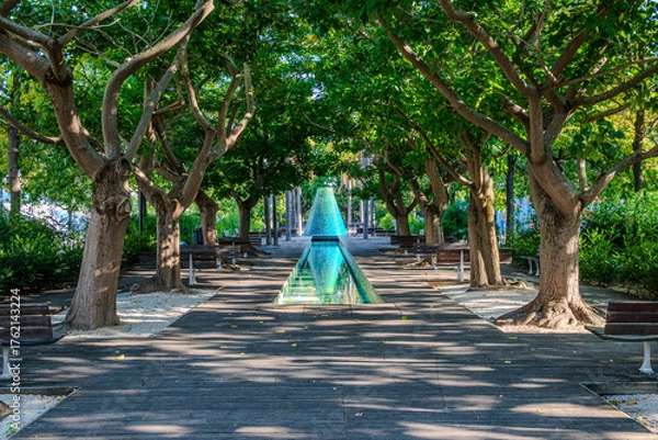 Fototapeta Fontes Vulcânicas Norte in Lisbon, features cone-shaped fountains that erupt water in rhythmic bursts, providing a playful and refreshing experience for visitors along the Alameda dos Oceanos