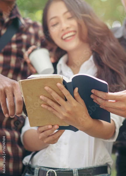 Obraz Group of Diversity Student reading book and working together,studying for an exam at university.,Happy multi ethnic friend successfully completes the thesis report in asian college-vertical image.