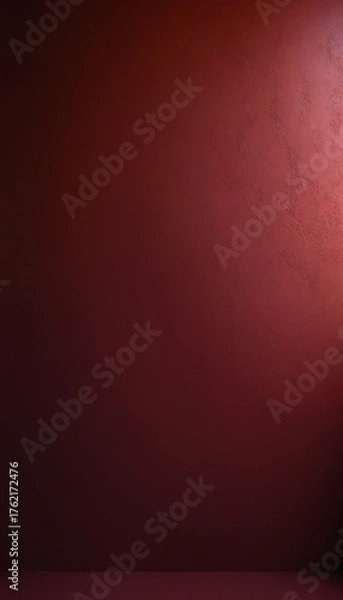 Fototapeta Dark red textured wall, in dramatic spotlight, a moody background for product display with copy space
