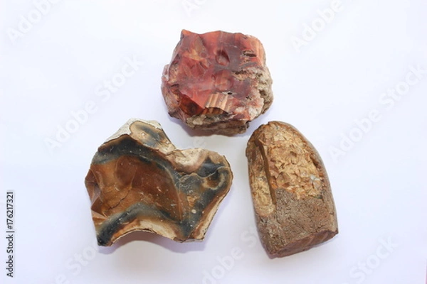 Obraz Three flintstones on a white background