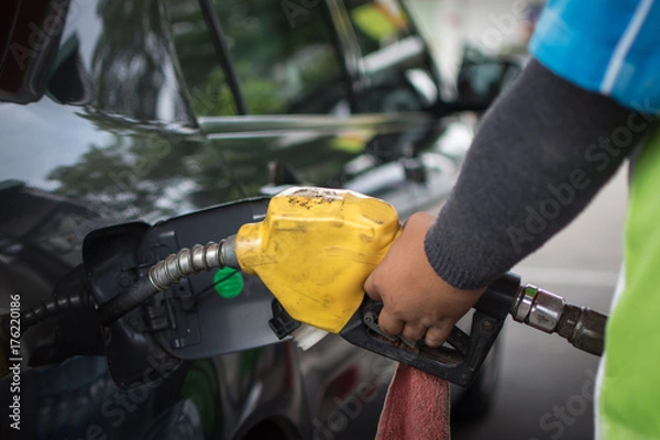 Fototapeta car refuel at Gas Station,out of fuel in the car