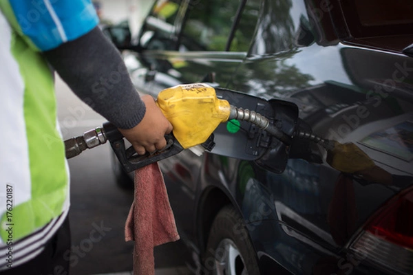 Fototapeta car refuel at Gas Station,out of fuel in the car