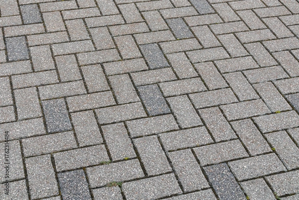 Fototapeta Gray cobblestone texture in perspective. Gray background with cobblestone pattern