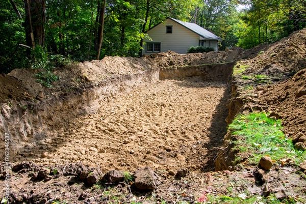 Fototapeta Completed excavaction of drain field for a home septic system
 system before fill material and piping are added.
