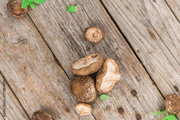 Obraz Portion of Raw Shiitake mushrooms on wooden background, selective focus
