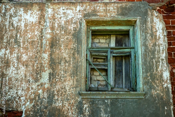 Obraz old wooden window, laid with bricks and boards