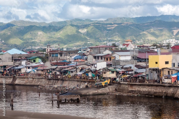 Fototapeta Poverty and nature in contrasting setting in the Philippines