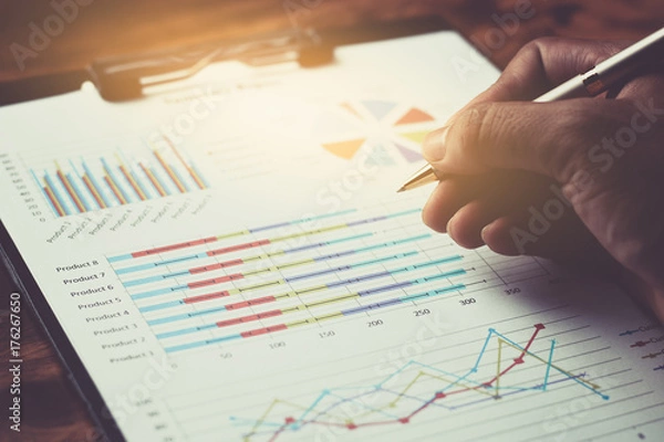 Fototapeta Business report plan put on the desk.