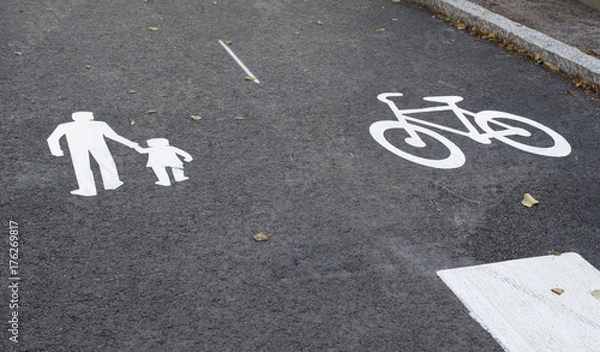 Fototapeta Asphalt. Marking of traffic. Bicycle path. Footpath. Background.The layout in the Finnish town of Porvoo.