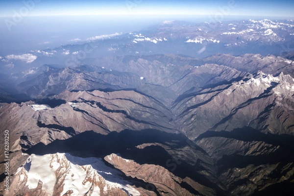 Fototapeta Top view image of the Himalaya mountain and blue sky from airplane window