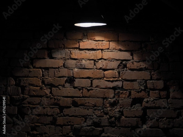 Obraz old wall lantern     .The old brick wall is lit by a flashlight
