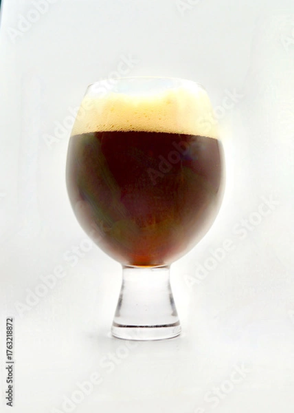 Obraz A glass of German style dunkel beer isolated against a white background.
